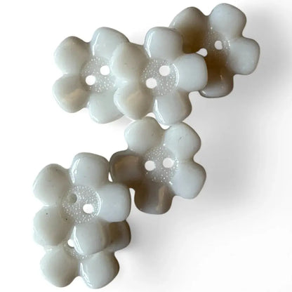 White flower-shaped buttons.