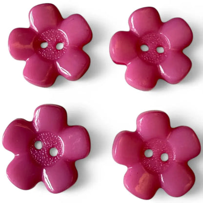 Four pink flower-shaped buttons.