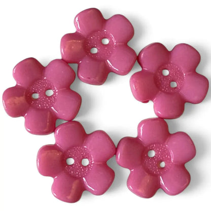 Five pink flower-shaped buttons.