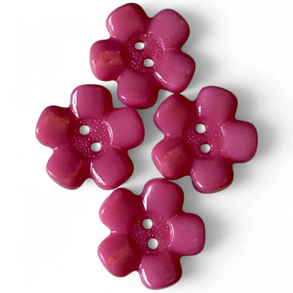 Four pink flower-shaped buttons.