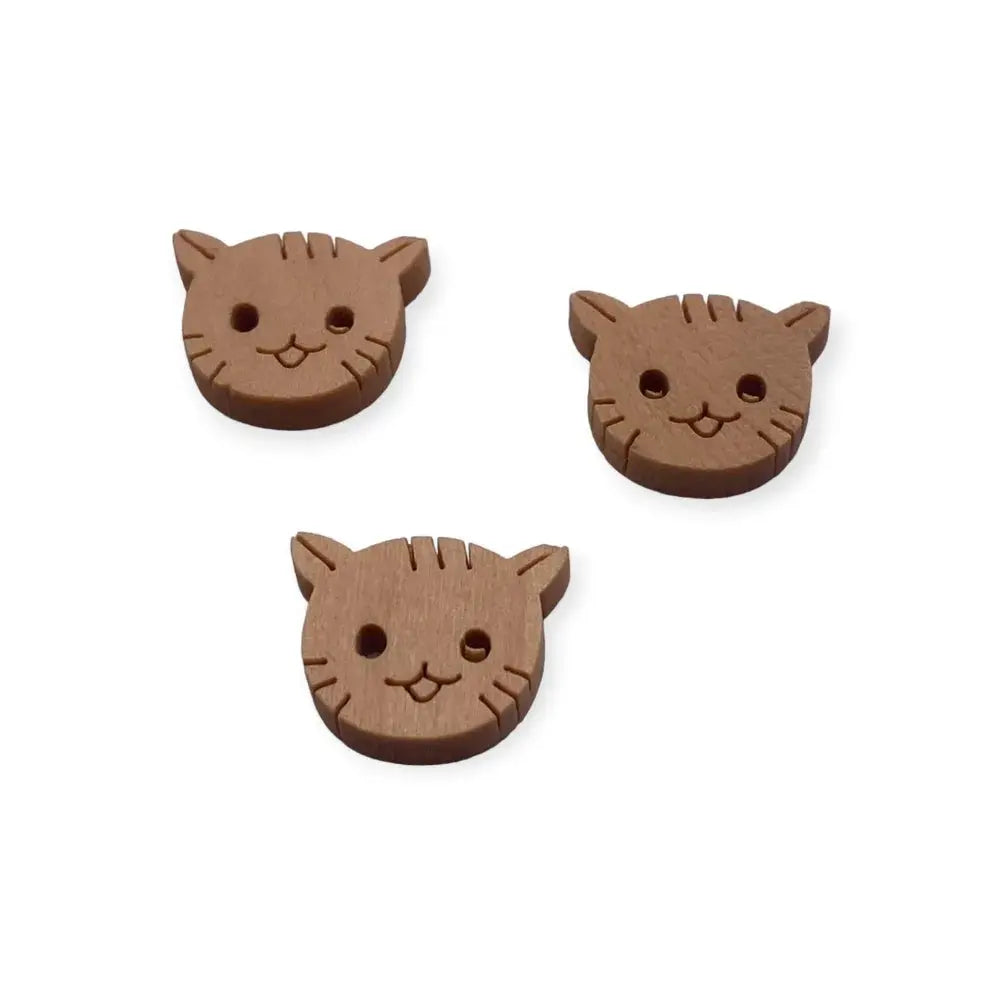 Three brown cat-shaped buttons.