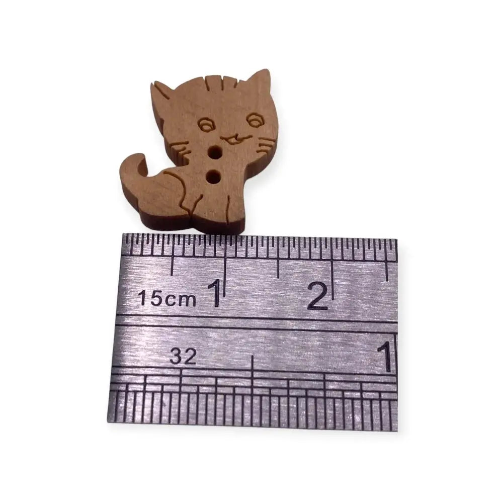 Wooden cat button.