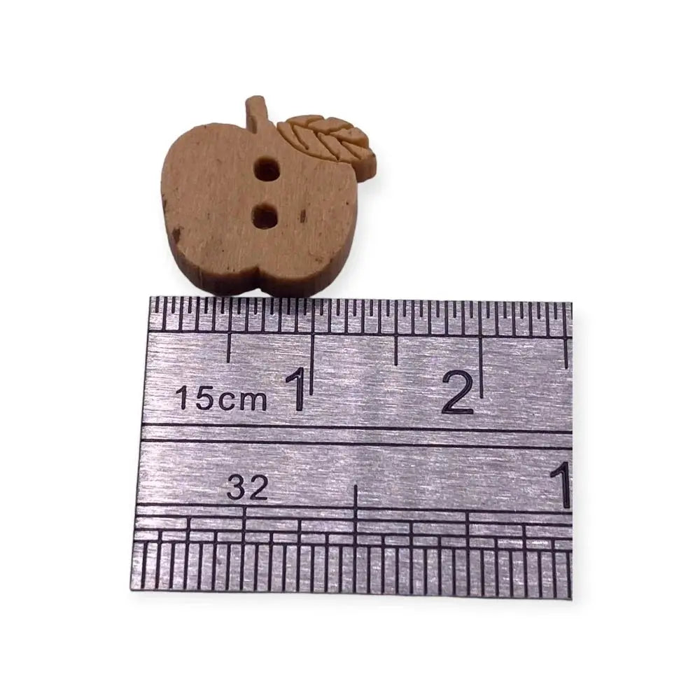 Brown apple-shaped button with two holes.