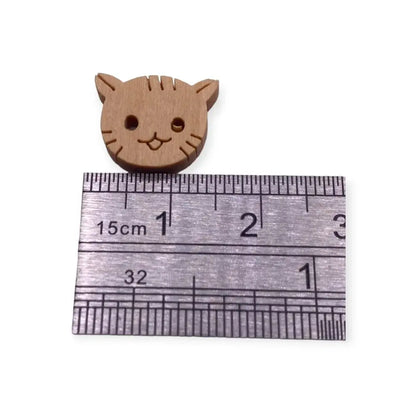 Wooden cat-shaped button.