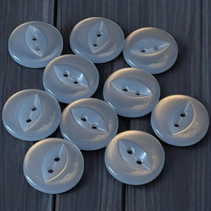 Ten white leaf-shaped buttons.