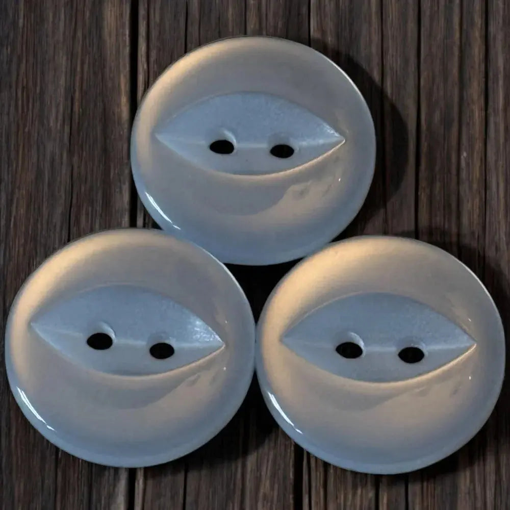 Three white, eye-shaped buttons.