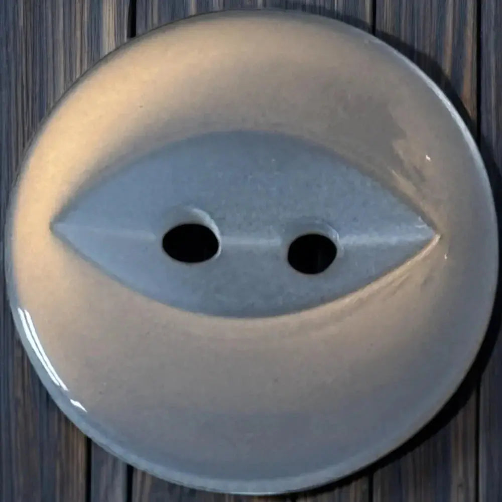White button with two holes.