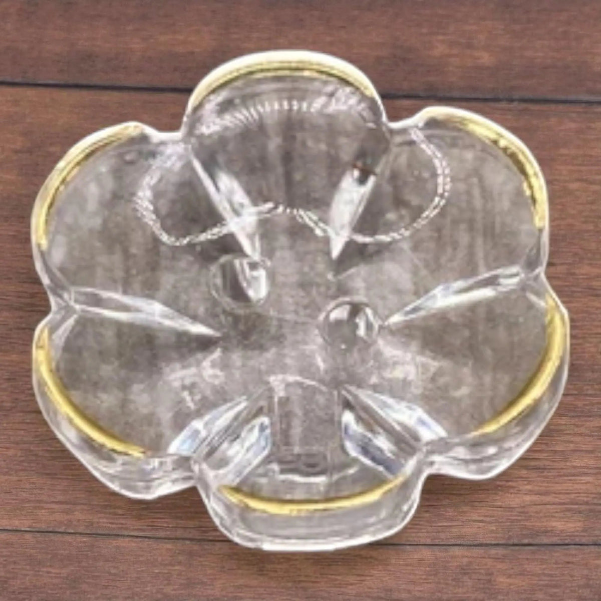 KnitForLess 13mm baby blue flower-shaped clear acrylic button with a gold rim and two-hole design for sewing.