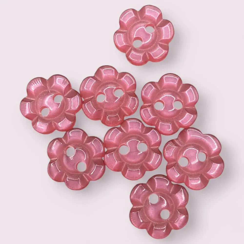 Pink flower-shaped buttons.