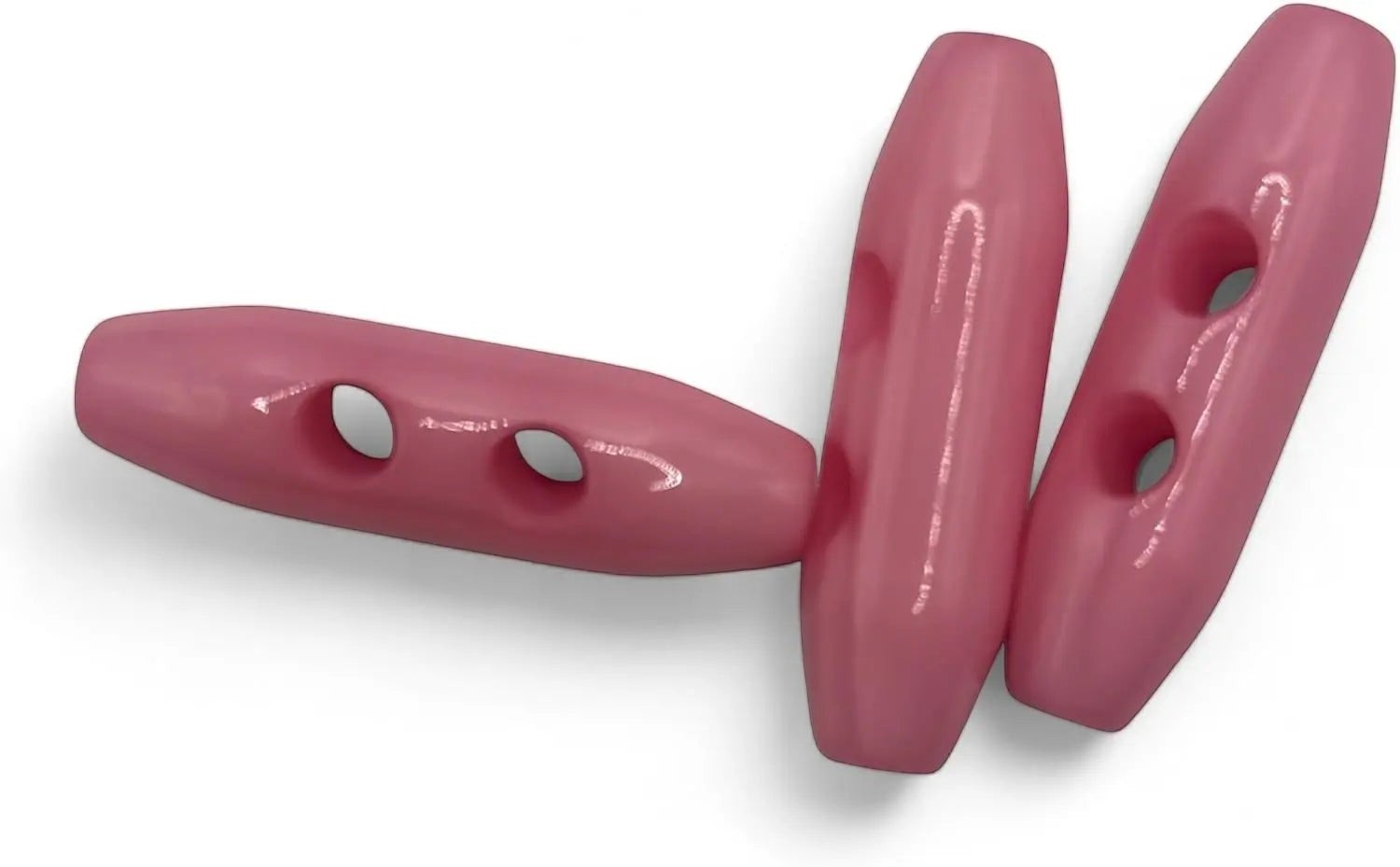 KnitForLess 38mm baby pink plastic toggle buttons with a 2-hole oval design for coats and jackets.