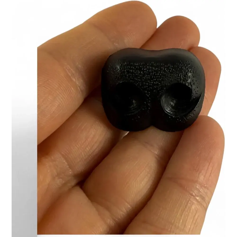 Black plastic clown nose.