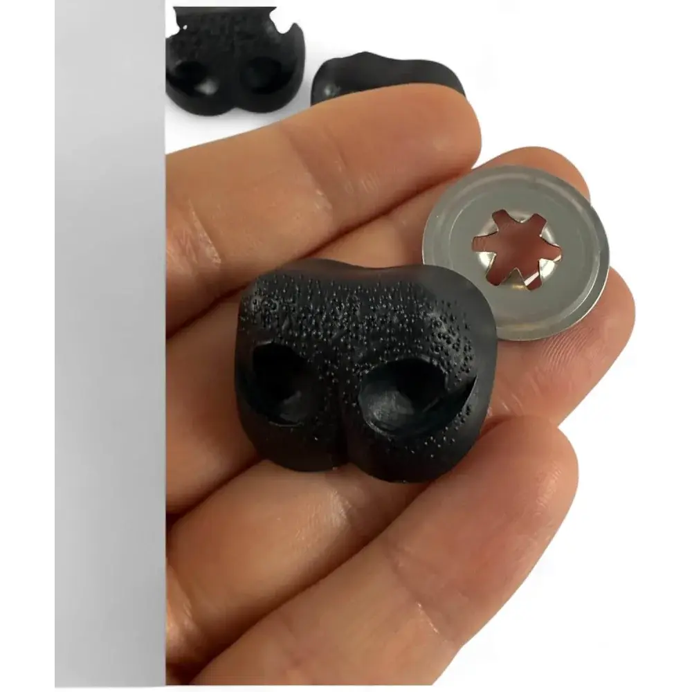 Black plastic pig snout with washer.