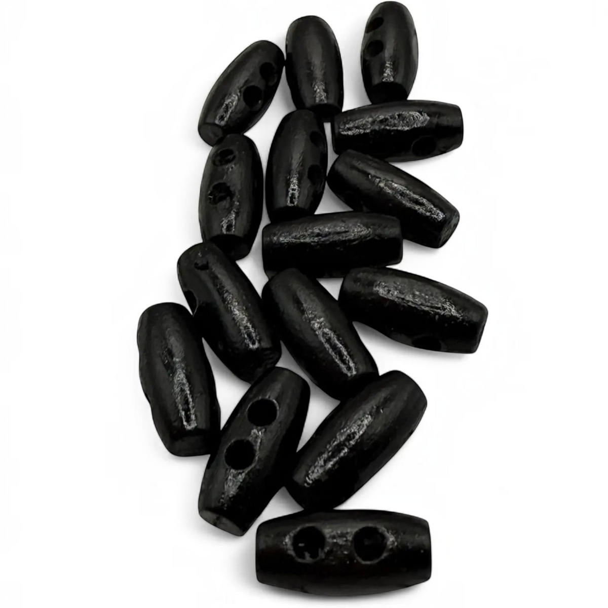 KnitForLess black wooden toggle buttons in a mini barrel shape for sewing and baby cardigans.