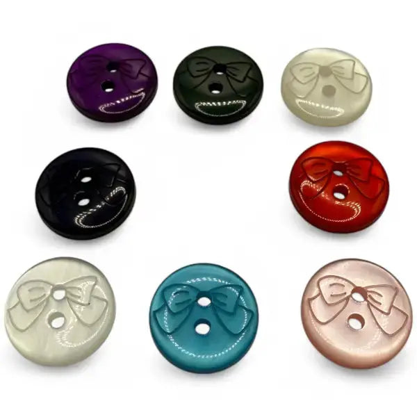 Colorful round buttons with bow design.