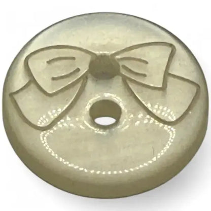 Round button with a bow design.