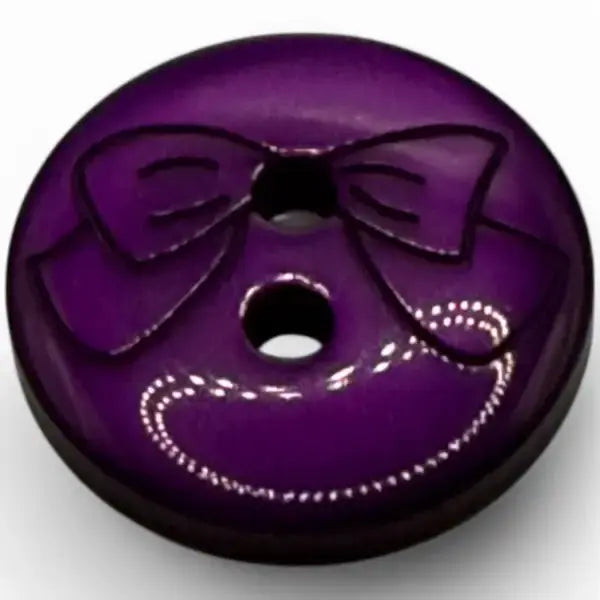 Purple button with bow design.