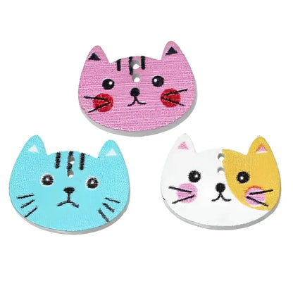 Three cat-shaped wooden buttons.