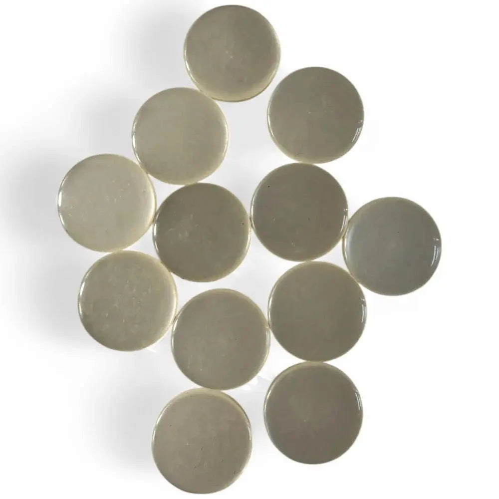 Circular, glossy, off-white discs.