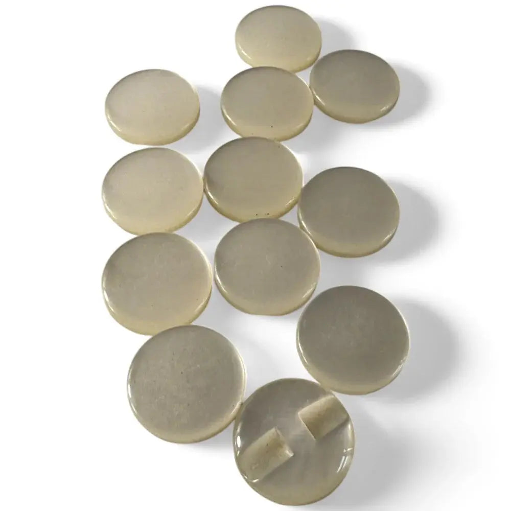 Collection of beige, round buttons.