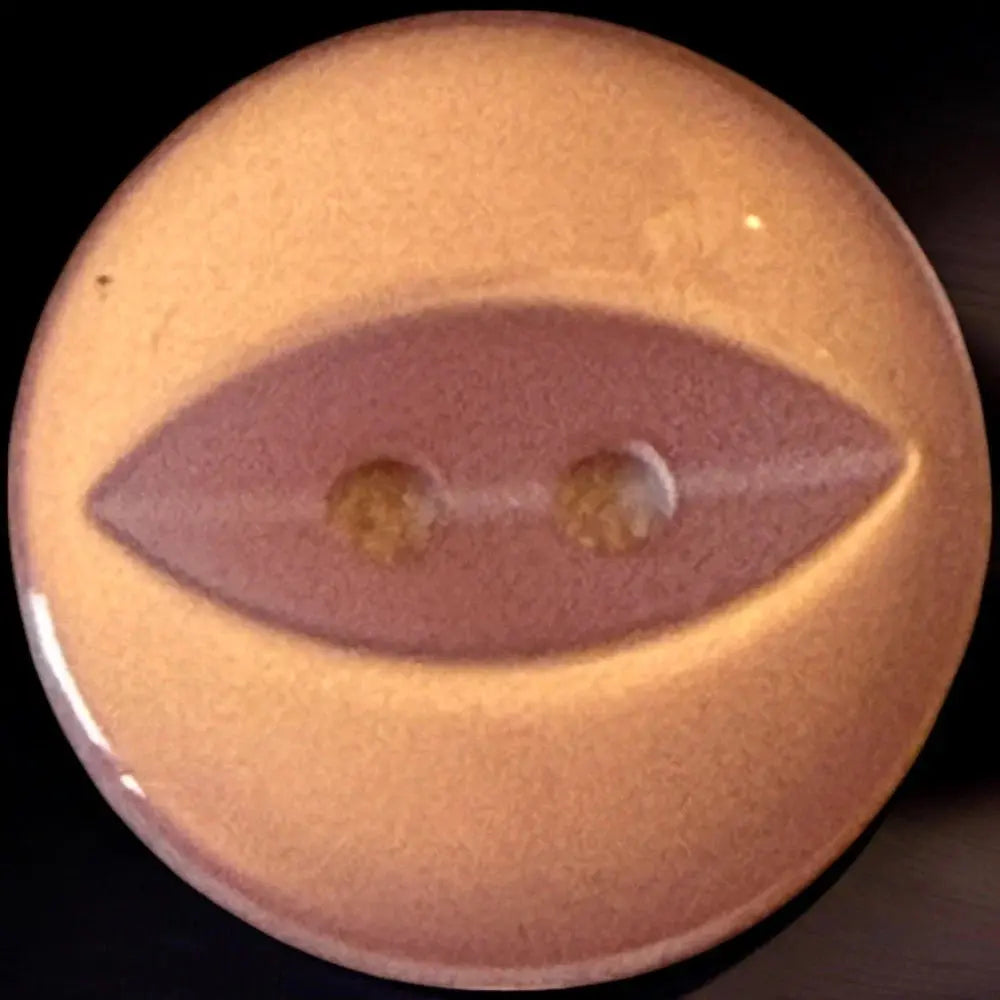 Round, two-hole, eye-shaped button.