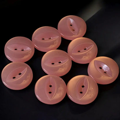 Pink, two-hole, domed buttons.