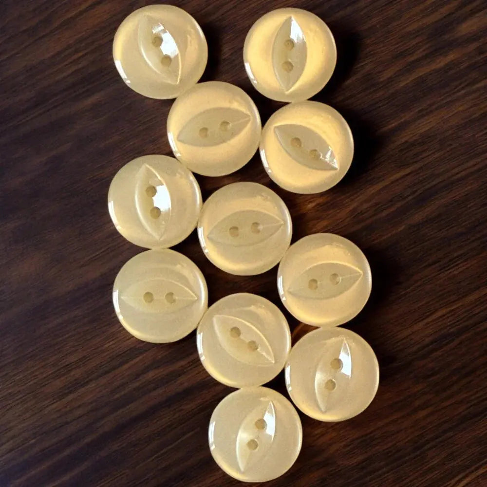 Collection of pale yellow buttons.