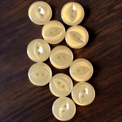 Collection of pale yellow buttons.