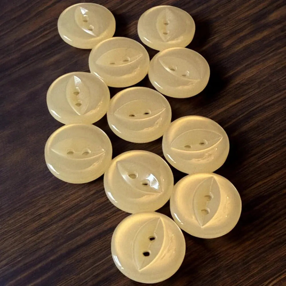 Collection of pale yellow buttons.