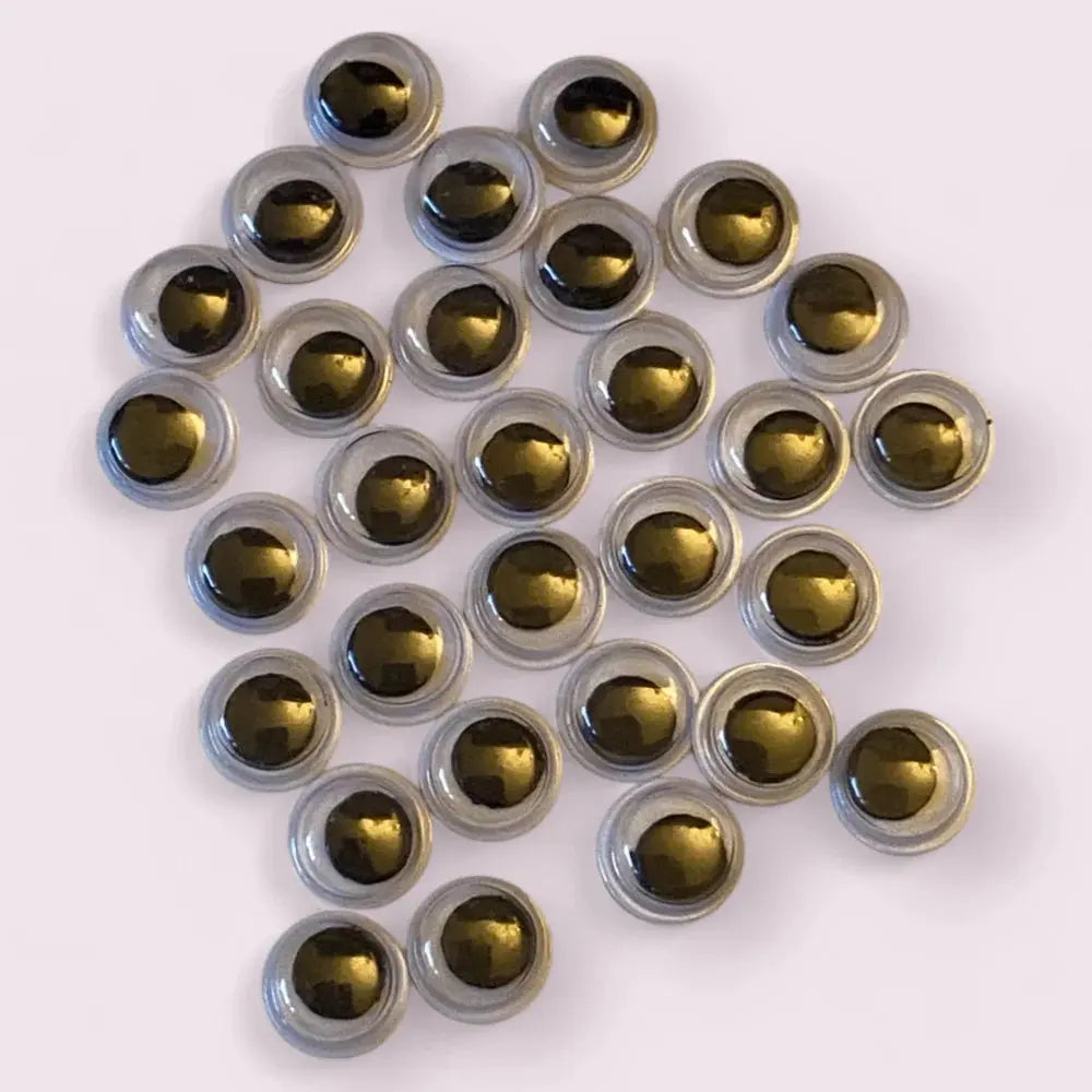 Pile of metallic-centered googly eyes.