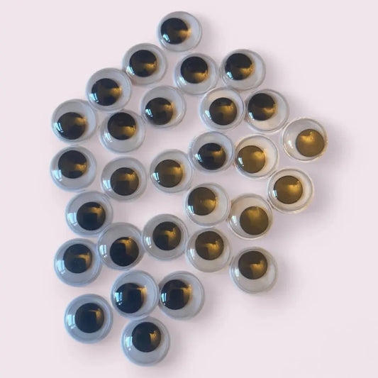 Pile of golden-eyed googly eyes.