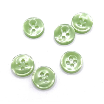 Pale green four-hole buttons.