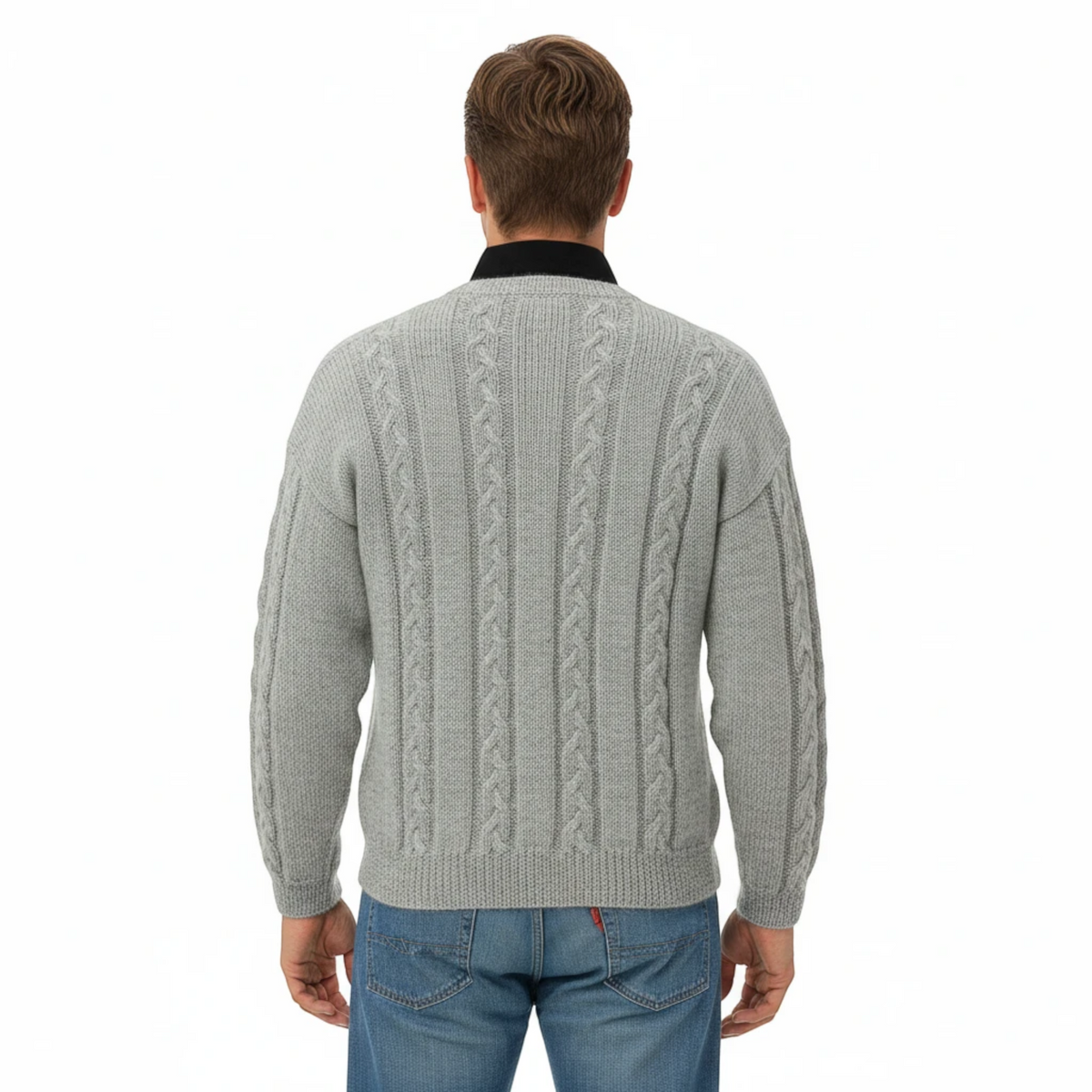 Back view of a man wearing a KnitForLess grey cable knit sweater with a textured vintage design over a black shirt.