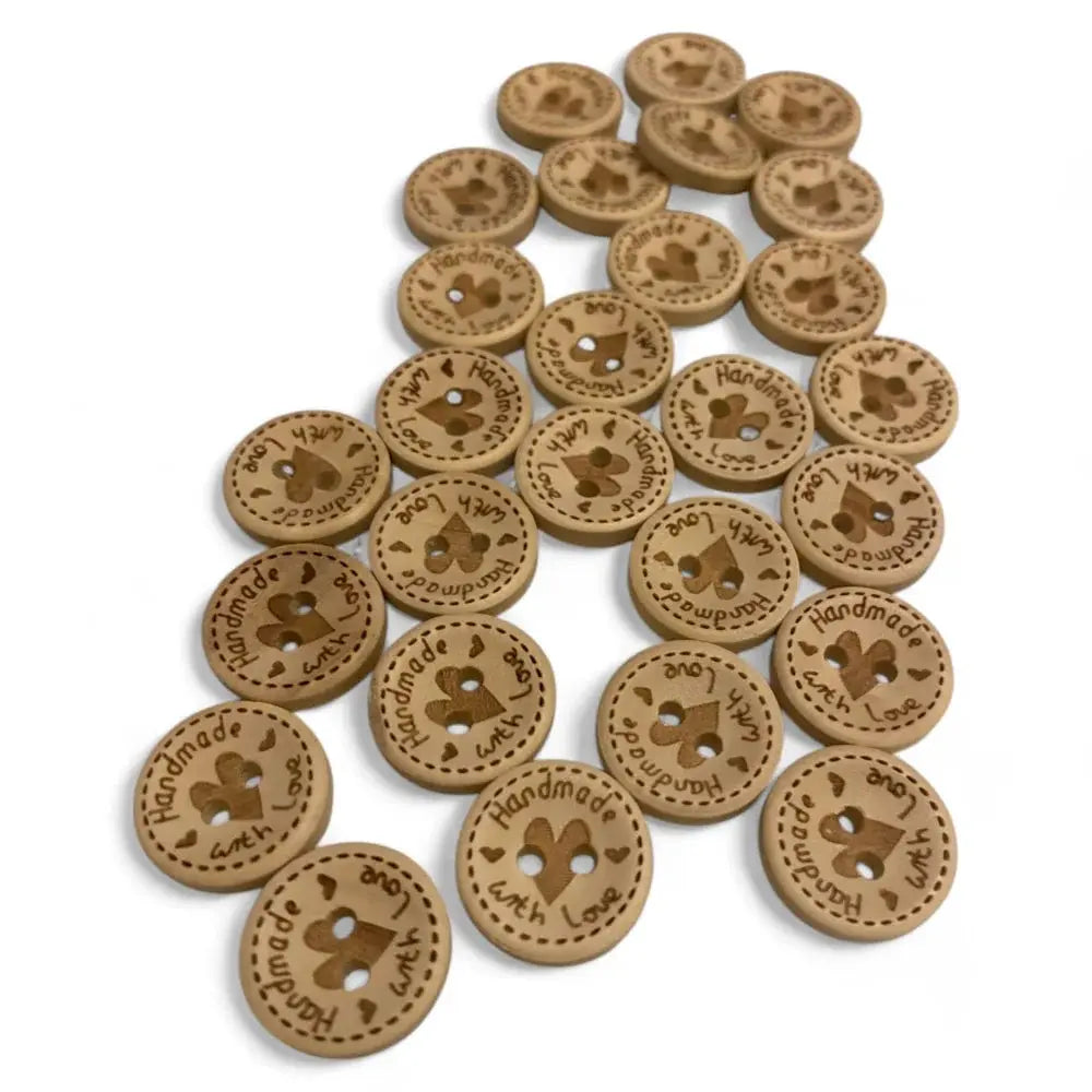 Round wooden buttons with heart design.