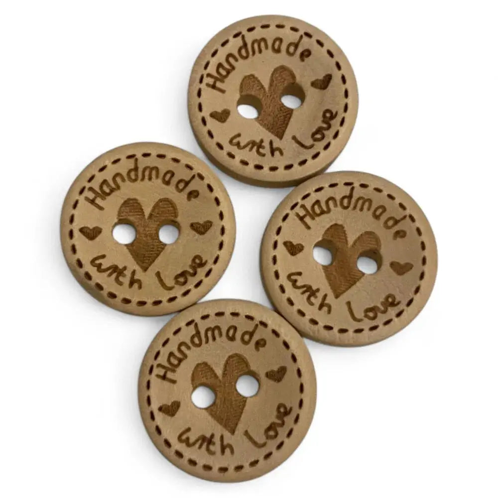 Four brown, round, ’handmade with love’ buttons.