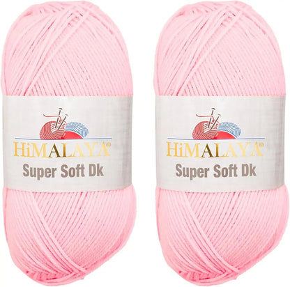 Two skeins of KnitForLess Himalaya Super Soft DK acrylic yarn in baby pink for knitting and crochet baby projects.