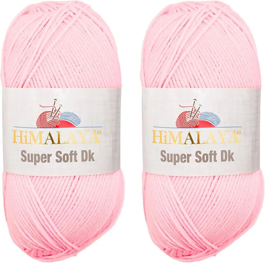 Two skeins of KnitForLess Himalaya Super Soft DK acrylic yarn in baby pink for knitting and crochet baby projects.