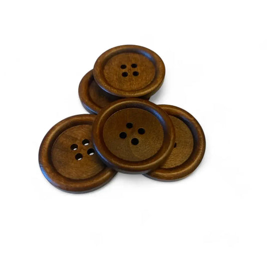 Pile of brown wooden four-hole buttons.