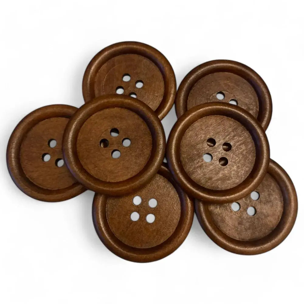 Pile of brown wooden buttons.