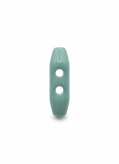 KnitForLess light blue toggle button with a smooth glossy finish and two holes for knitwear and apparel projects.
