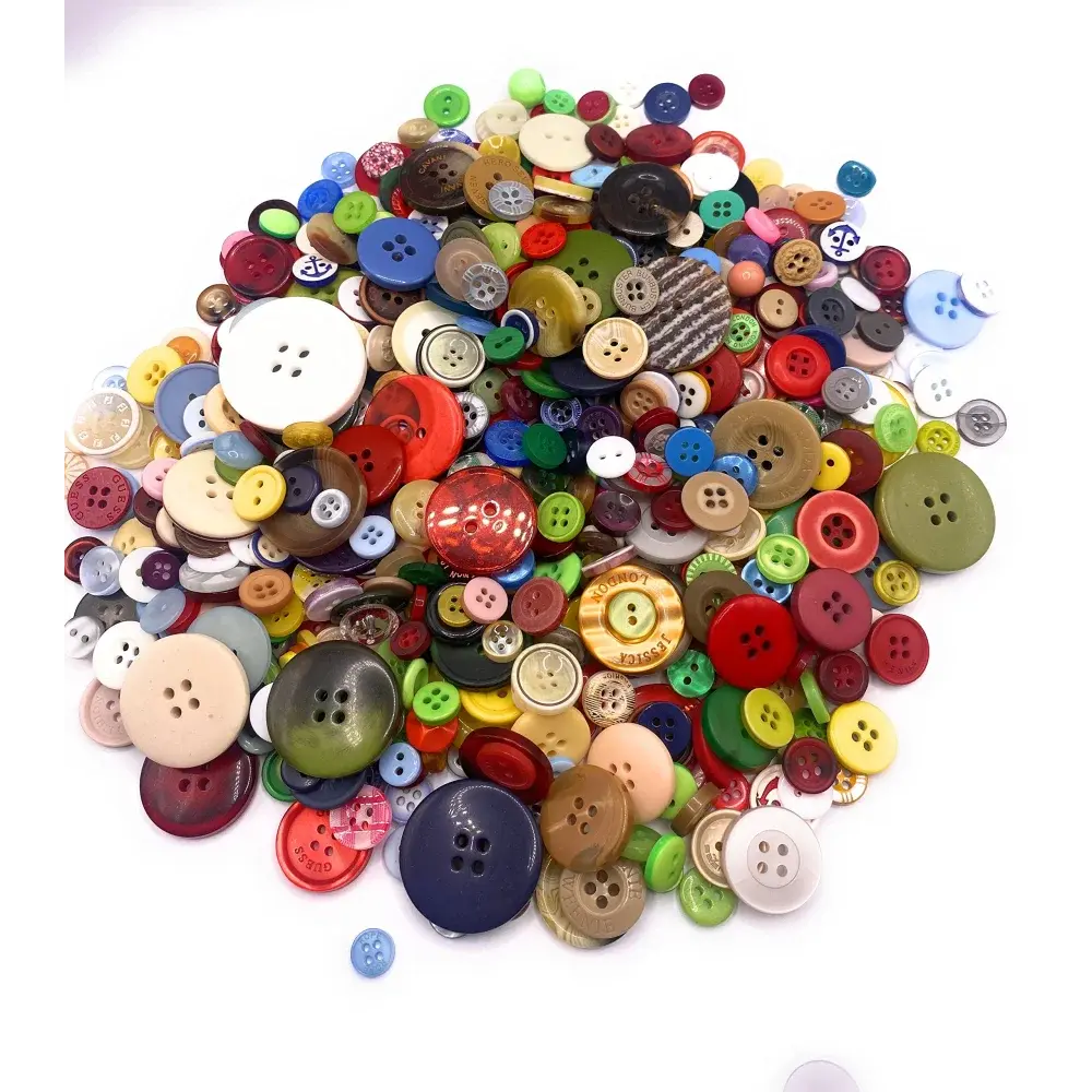 Pile of colorful assorted buttons.