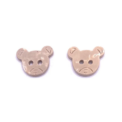 Two beige bear-shaped buttons.