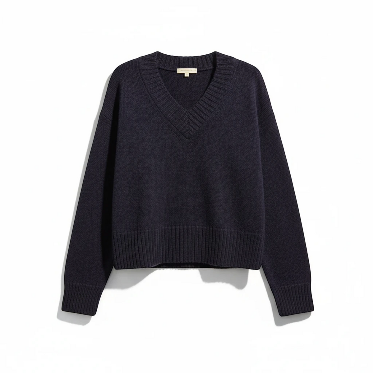 KnitForLess vintage style navy blue boxy knit sweater with a ribbed V-neckline and deep ribbed hem.