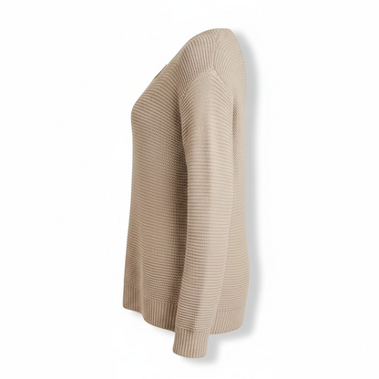 KnitForLess oversized garter stitch sweater in beige with a wide neck and dropped shoulders, side view.