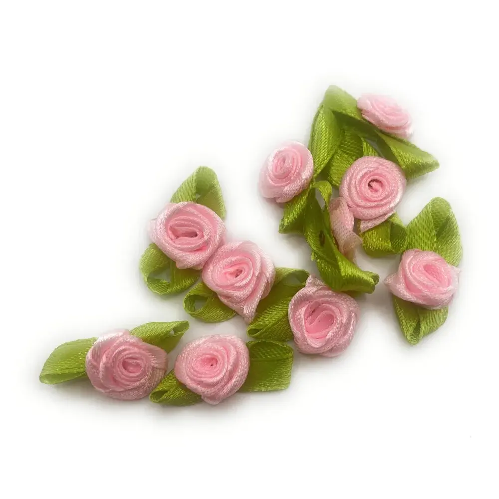 Pink ribbon roses with green leaves.