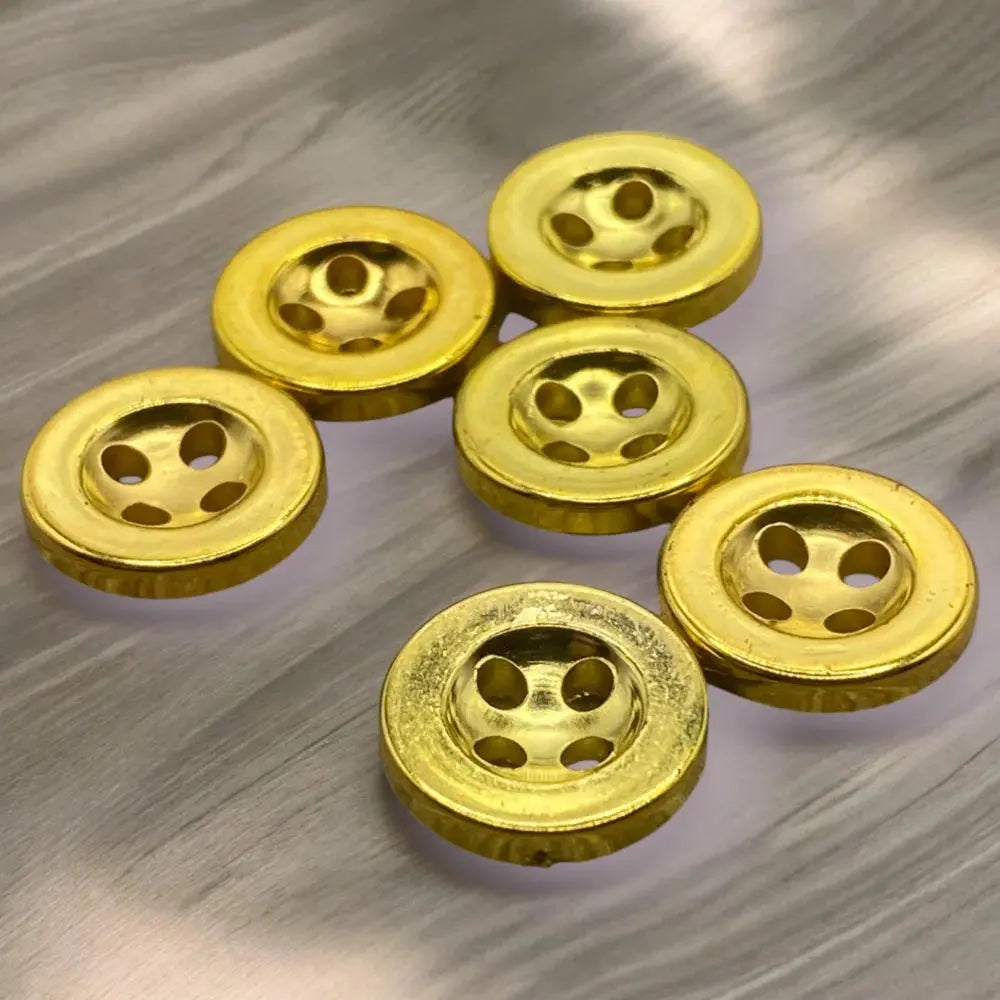 Six golden, four-hole buttons.