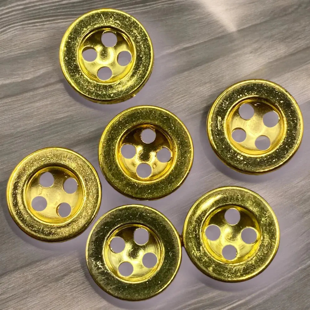 Six gold-colored, four-hole buttons.