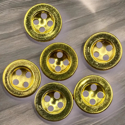 Six gold-colored, four-hole buttons.