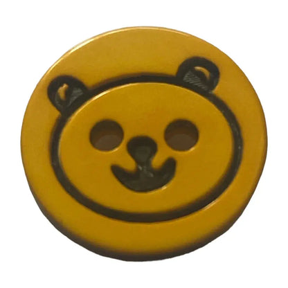 Yellow button with bear face.
