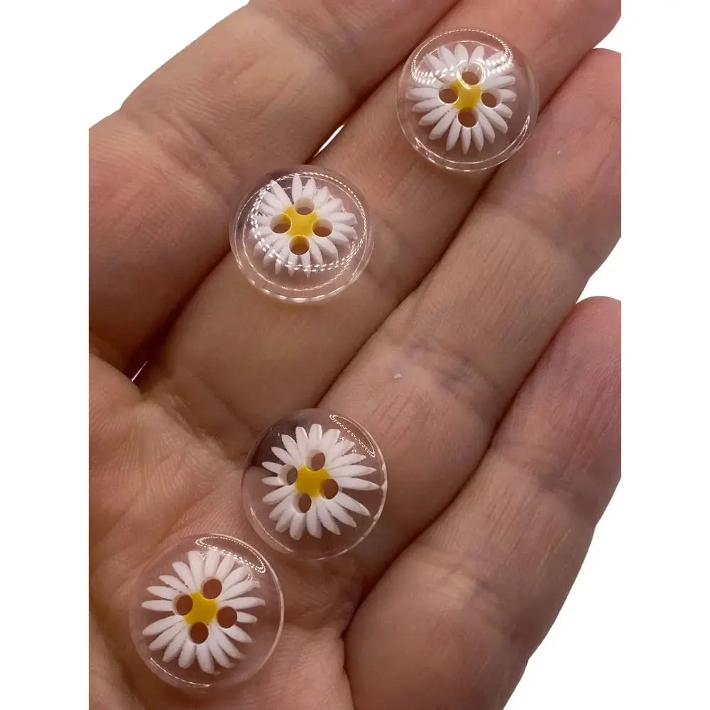 Daisy-themed clear buttons.