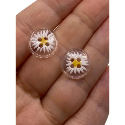 Two clear daisy buttons.